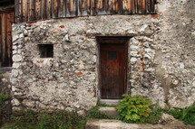 wood door on a stone cabin 