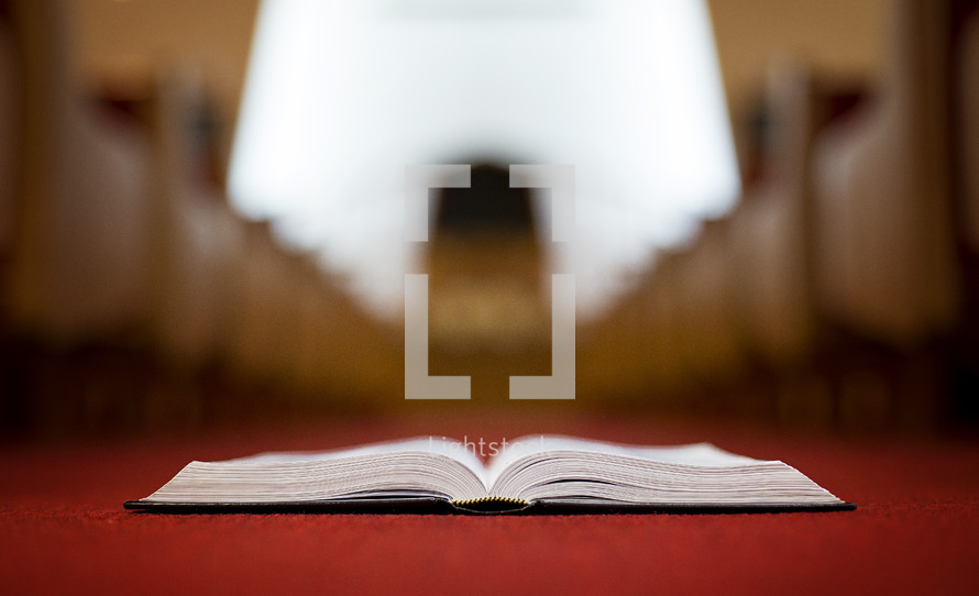 Bible in the aisle of a church 