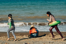 children playing on a beach 