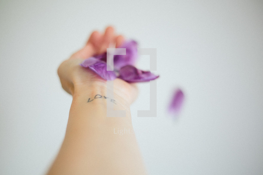 love tattoo and purple petals 