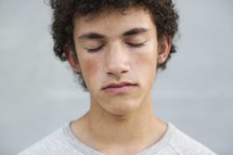 teen boy with closed eyes 