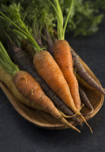 carrots in a wooden bowl 