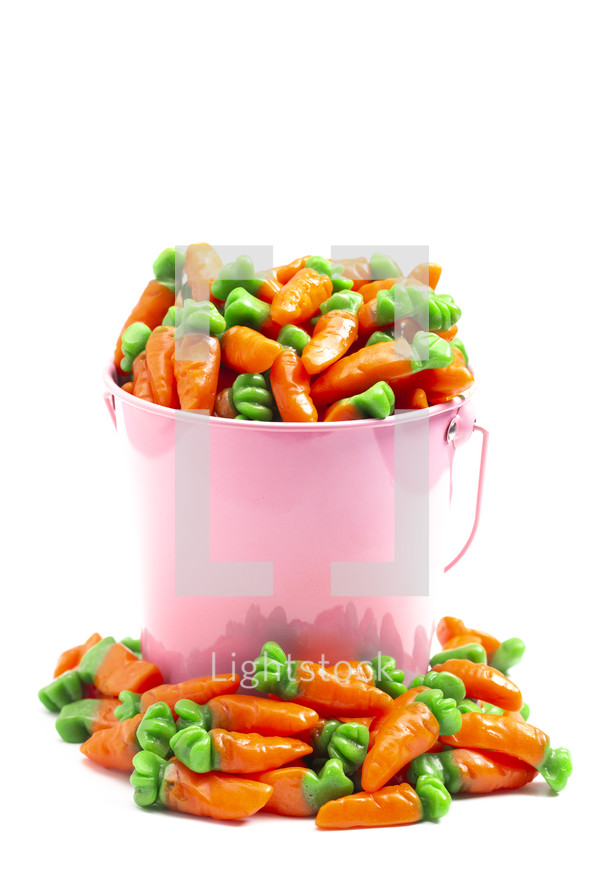 candy gummy carrots in a pink bucket for Easter 