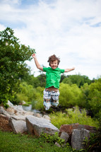 a child jumping in the air 