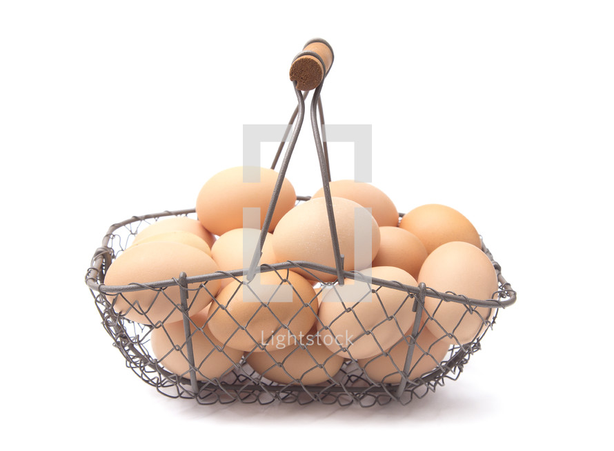 fresh eggs in a wire basket 