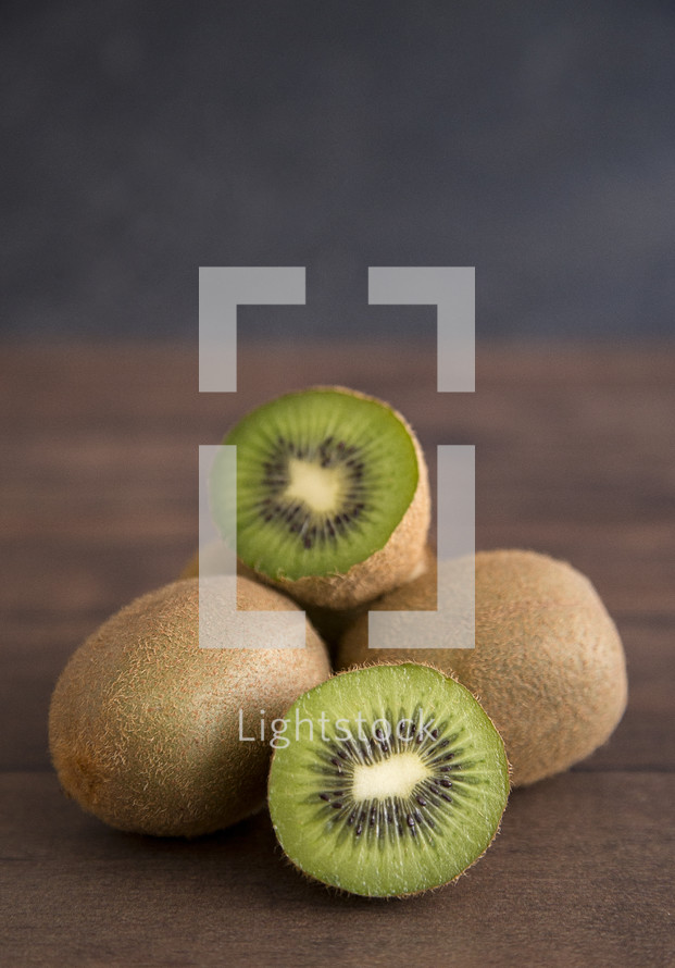 kiwi fruit on a wood table 