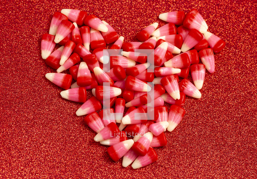 Red Pink and White Valentines Day Candy Corn Isolated on a red Background
