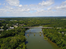 aerial view over a river and bridge 