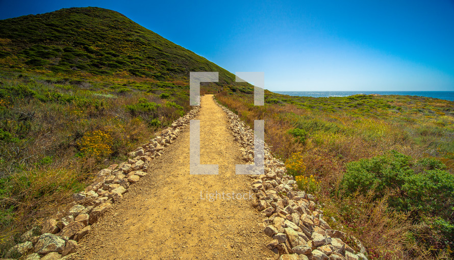path and California shoreline view 