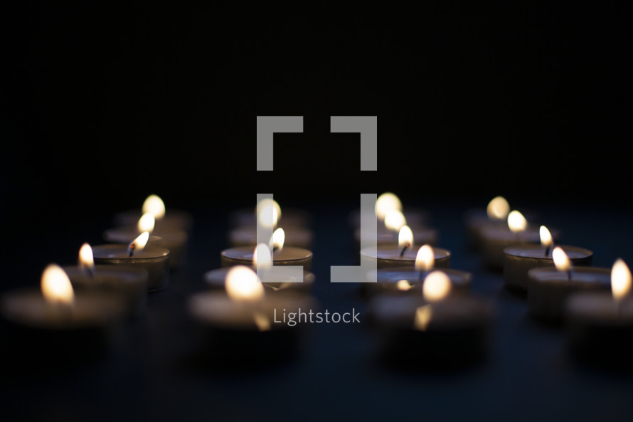 rows of candles with copyspace