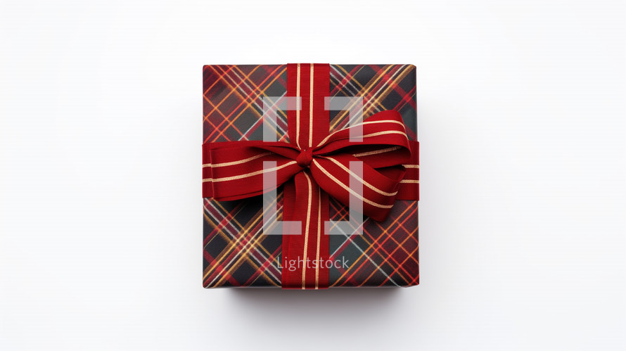 Red plaid gift with ribbon bow. 