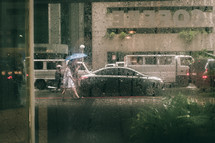 pedestrians walking in the rain 
