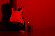 electric guitar and candles 