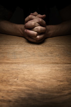 interlaced praying hands 