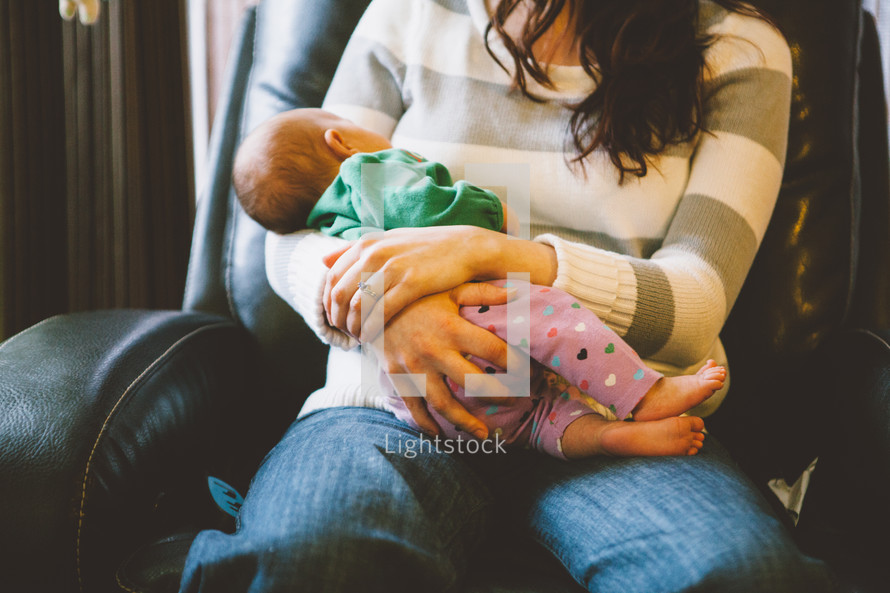 Mother holding her infant child.
