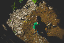 a child walking through a stream 