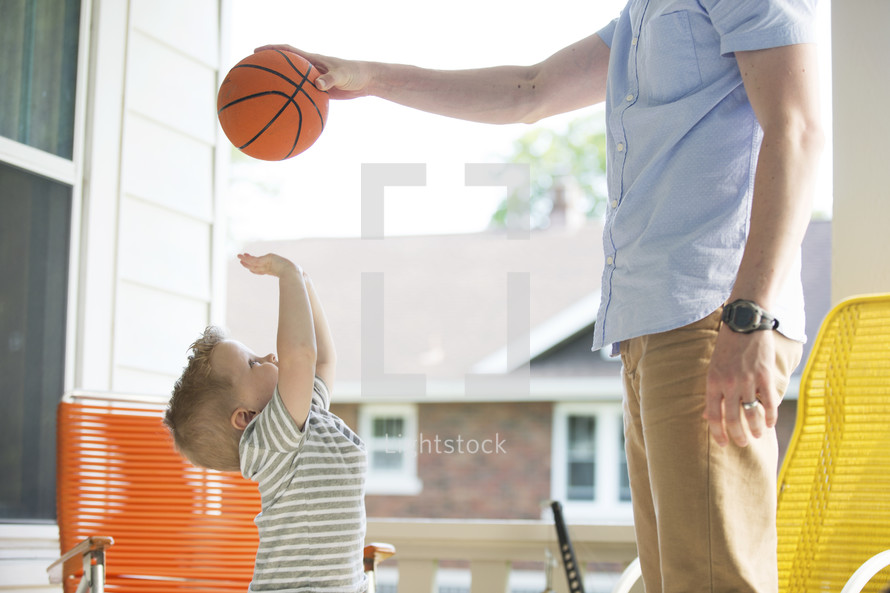 father and son with a basketball 