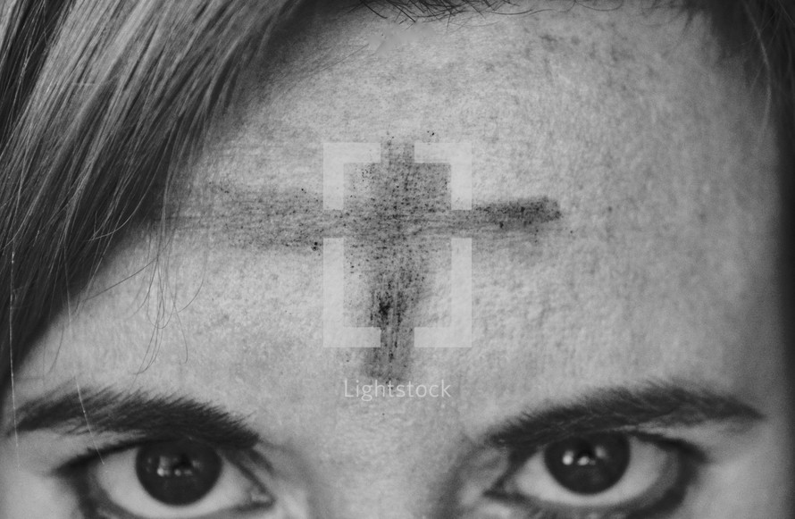 cross Ashes on a woman's forehead 