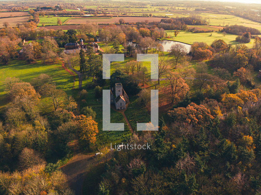 Drone photograph of a small church surrounded by beautiful countryside