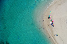 Aerial drone view of iconic small uninhabited island of Marathonisi featuring clear water, sandy shore and natural hatchery of Caretta-Caretta sea turtles, Zakynthos, Greece