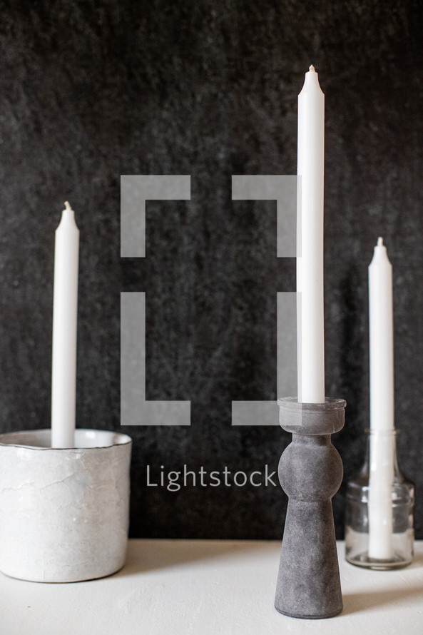 candles against a black background 