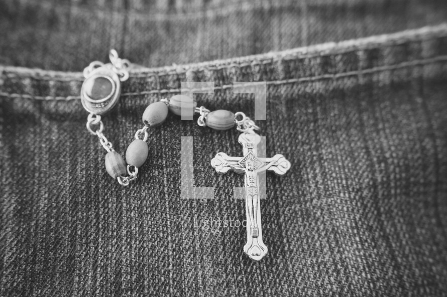 rosary in a jeans pocket 