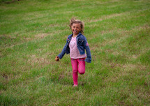 a child running in grass