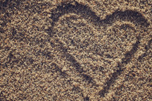 heart drawn in the sand 
