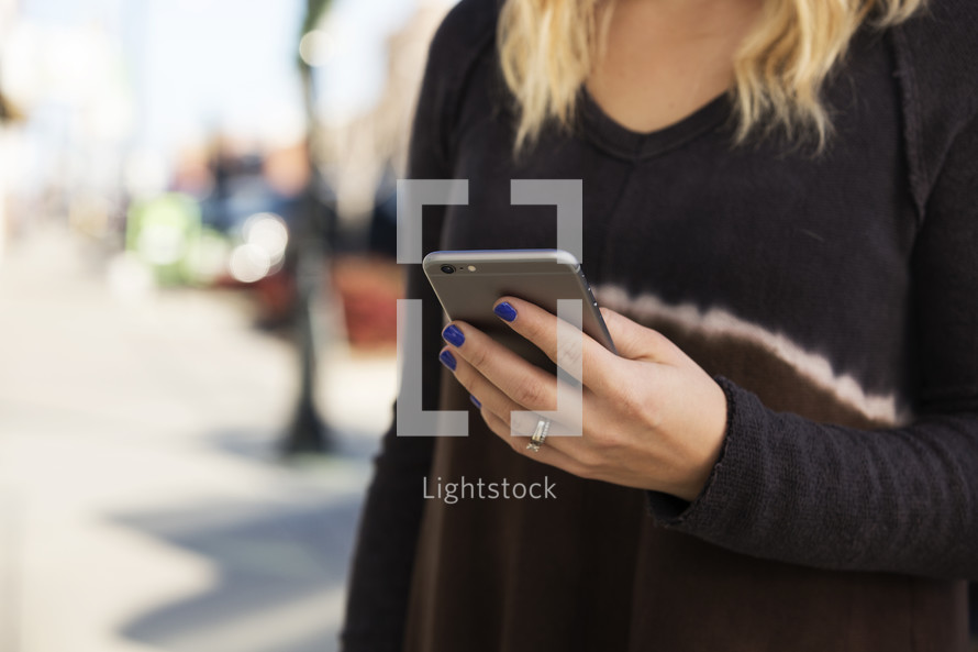 a teen girl checking her cellphone 