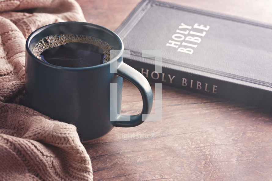 coffee cup and sweater with Bible 