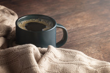 coffee cup and sweater 