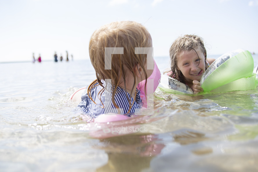 kids swimming at the beach 