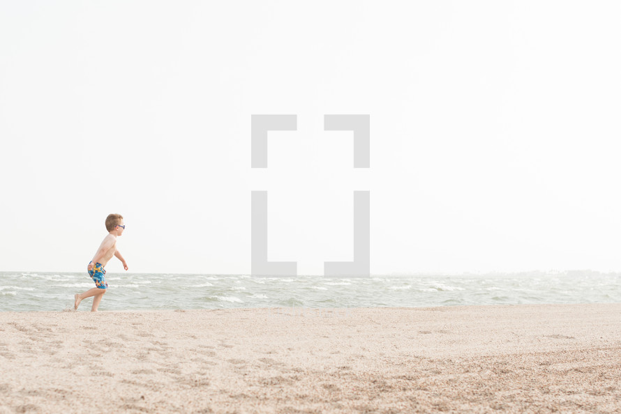 child running on a beach 
