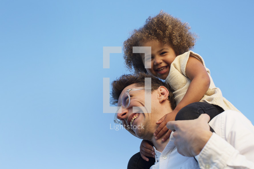 riding on father's shoulders 
