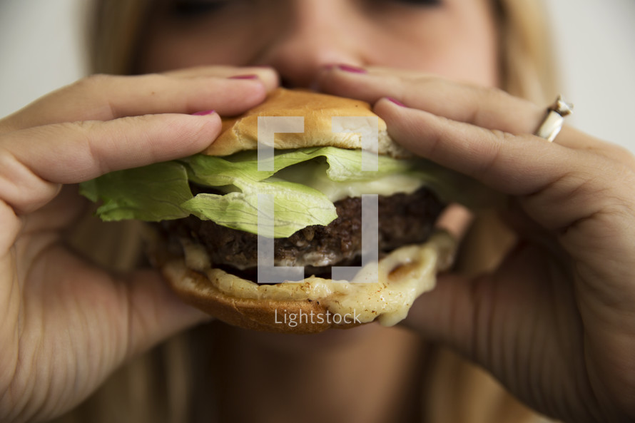 woman eating a burger 