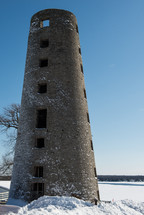 stone tower in snow 