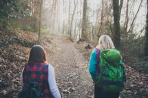 women walking on a nature trail 
