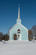 blue church in snow 