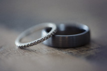 wedding bands laying on top of one another. 