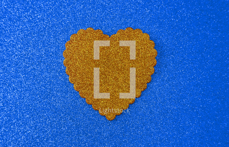 gold heart on blue 