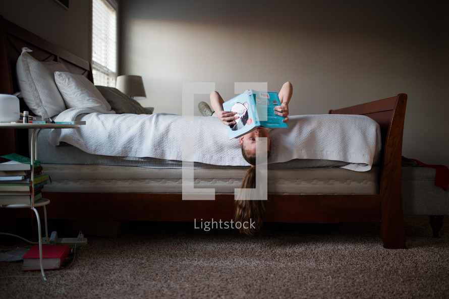 girl reading in bed 