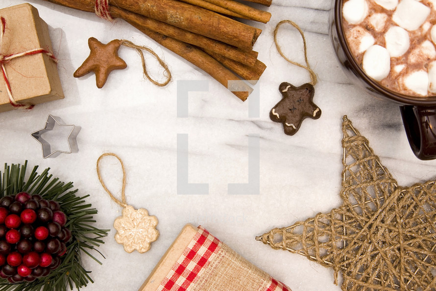 cinnamon sticks, ornaments, hot cocoa, and gift box border for Christmas 