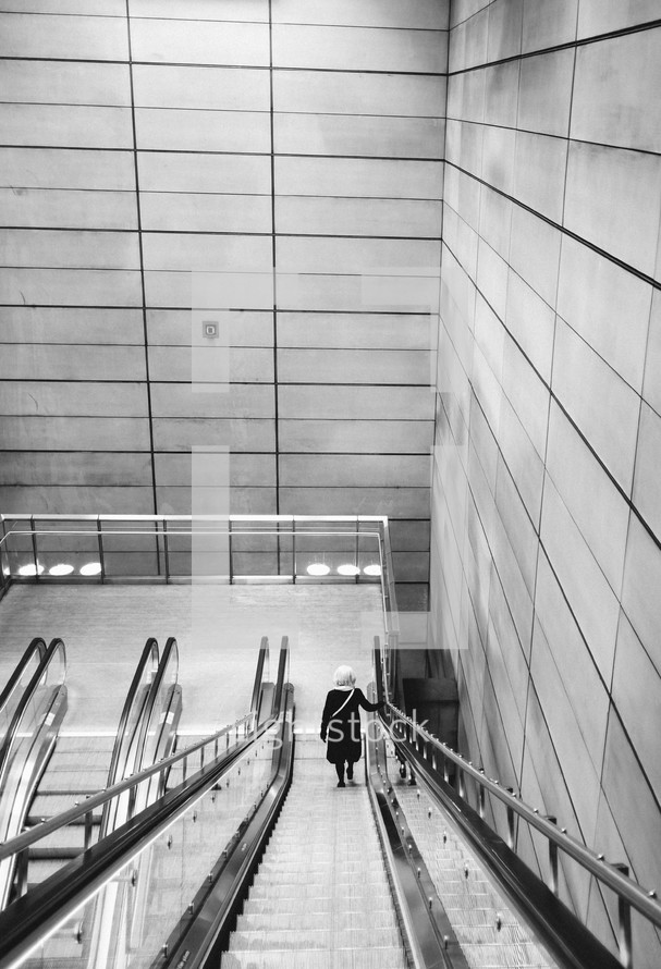 woman on an escalator 