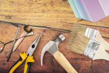 Tools and Needed Things for Home Improvement on a Wooden Table