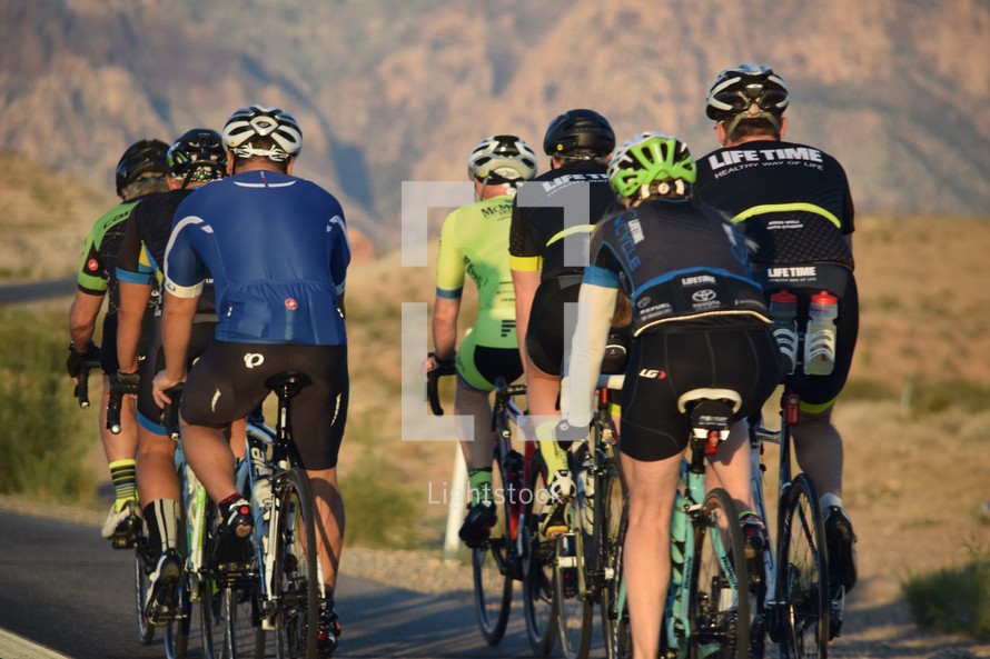 group of bike riders riding the scenic loop of Red Rock Canyon 