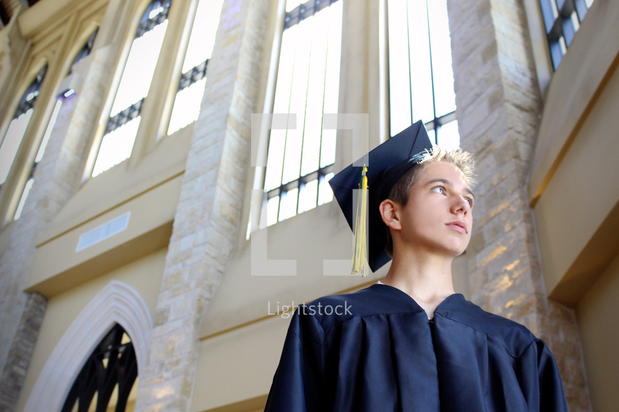 teen boy in his cap and gown