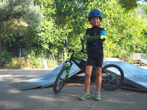 child with a bike at a bike park 