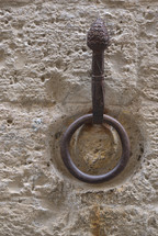 metal ring on a stone wall in Italy 