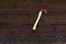 ax on a wood wall 