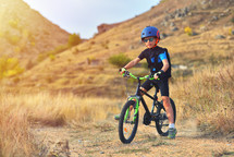 child on a bike on a trial 
